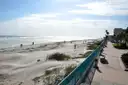 Daytona Beach's wide sand and dunes beside a beach walkway