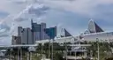 The arched roofs of the Orange County Convention Center with hotel towers behind