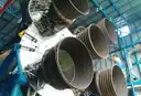 The giant engine nozzles of a Saturn V rocket in a hall at Kennedy Space Center