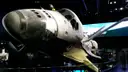 The space shuttle Atlantis on display in its hall, cargo doors open