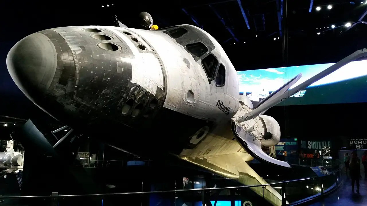 The space shuttle Atlantis on display in its hall, cargo doors open