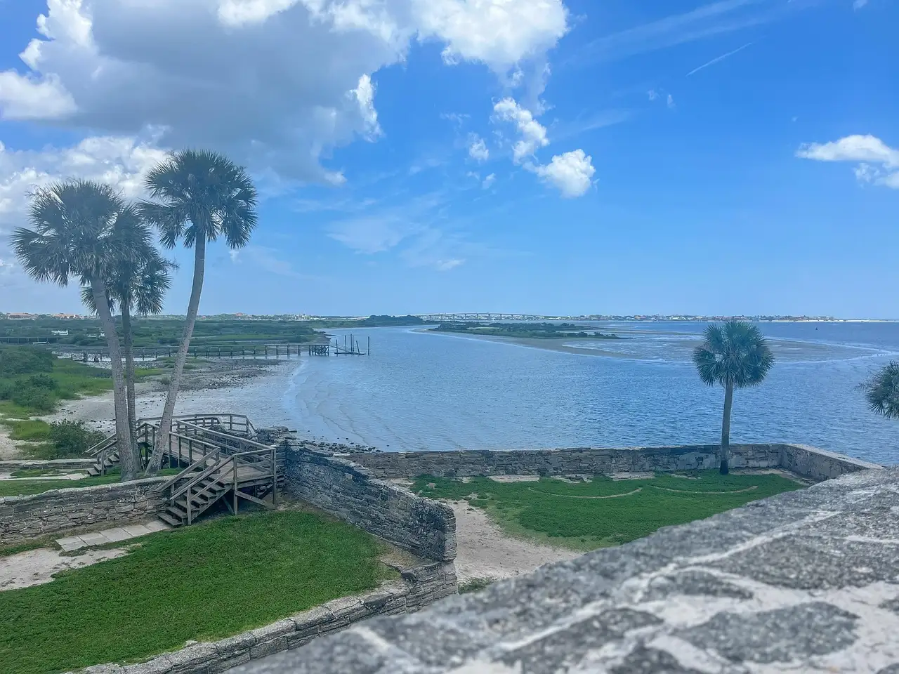 The view from St. Augustine's old stone fort over the bay, with palm trees