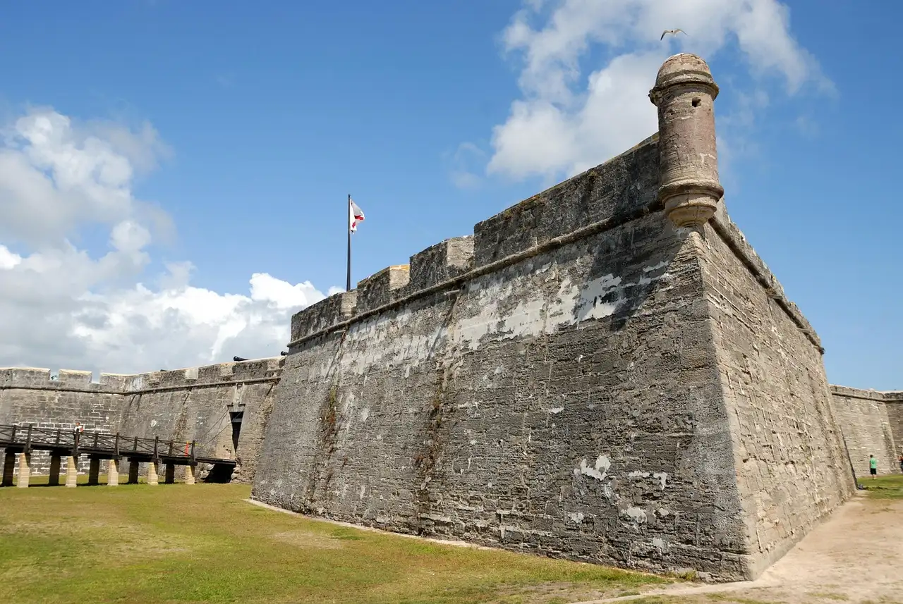 The coquina stone walls and corner watchtower of the Castillo de San Marcos fort in St. Augustine