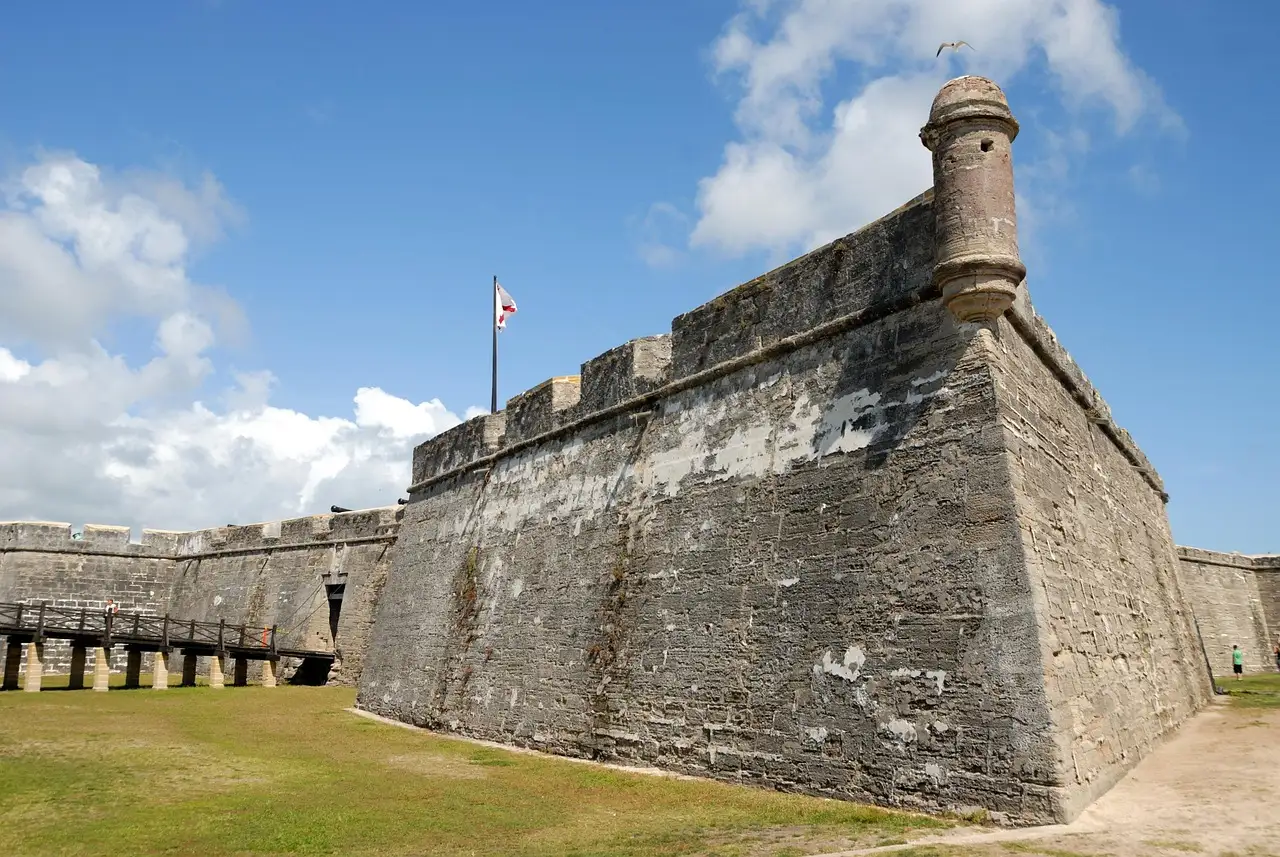 The coquina stone walls and corner watchtower of the Castillo de San Marcos fort in St. Augustine