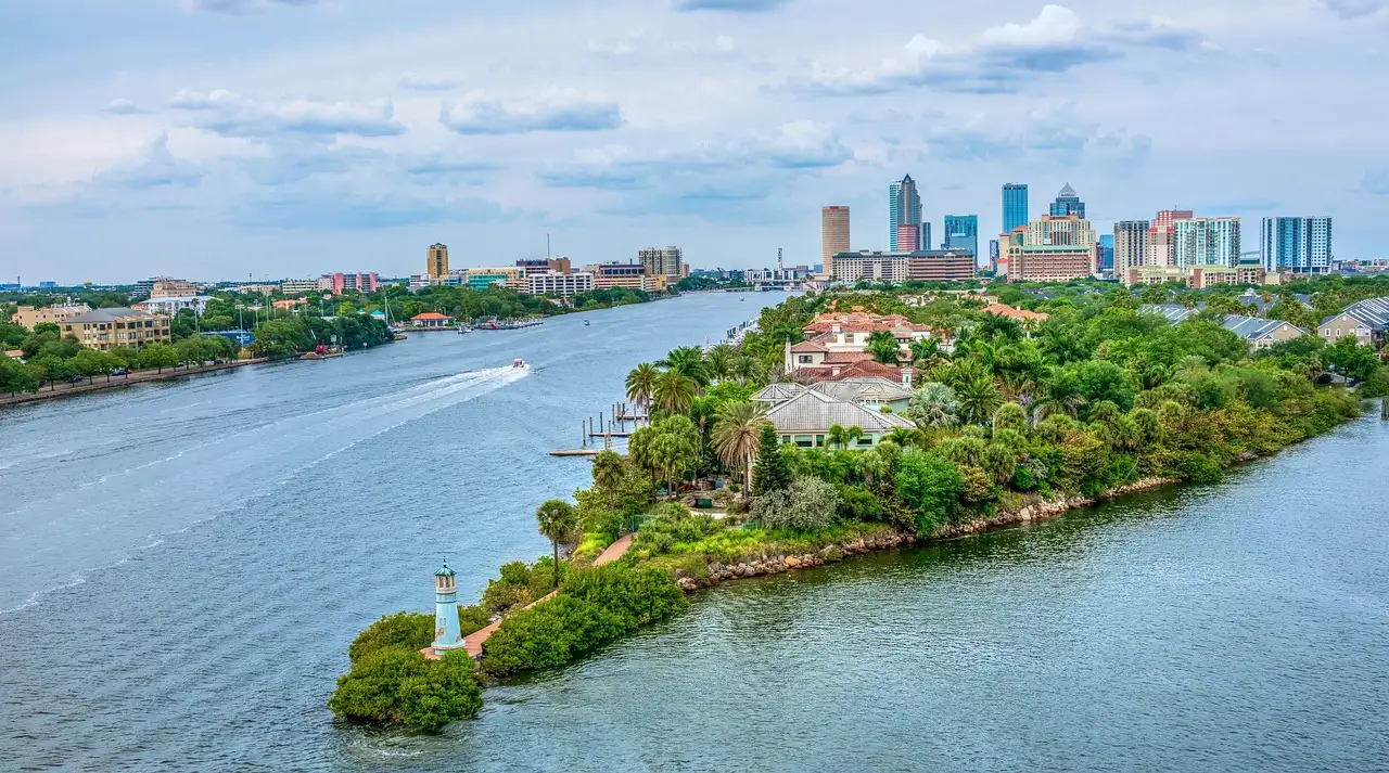 Aerial view of the Tampa skyline and a green island in the river