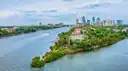 Aerial view of the Tampa skyline and a green island in the river